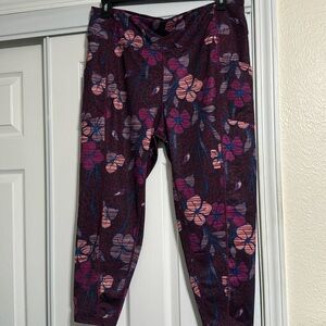 Multi color capris with side pockets. Never worn. Flower design.